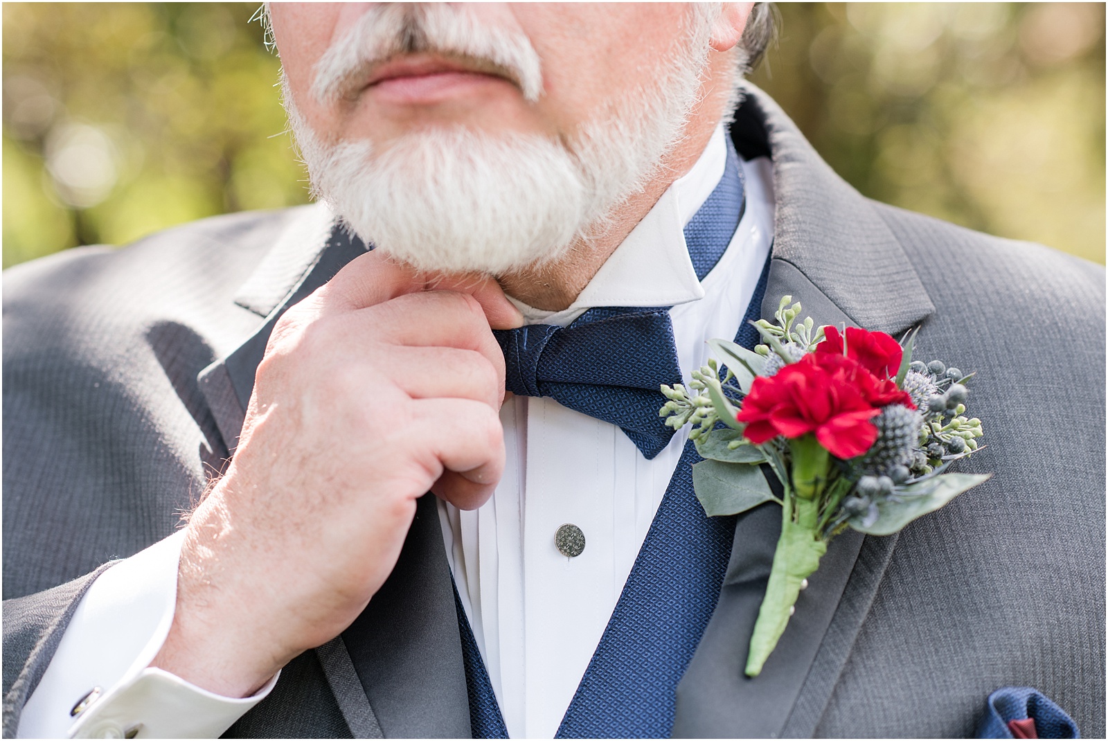 Michelle and Sara Photography, Michelle and Sara weddings, michelle robinson photography, burke manor inn, groom details, boutonniere, floral details for groom, red florals, fall boutonniere, navy and grey suit