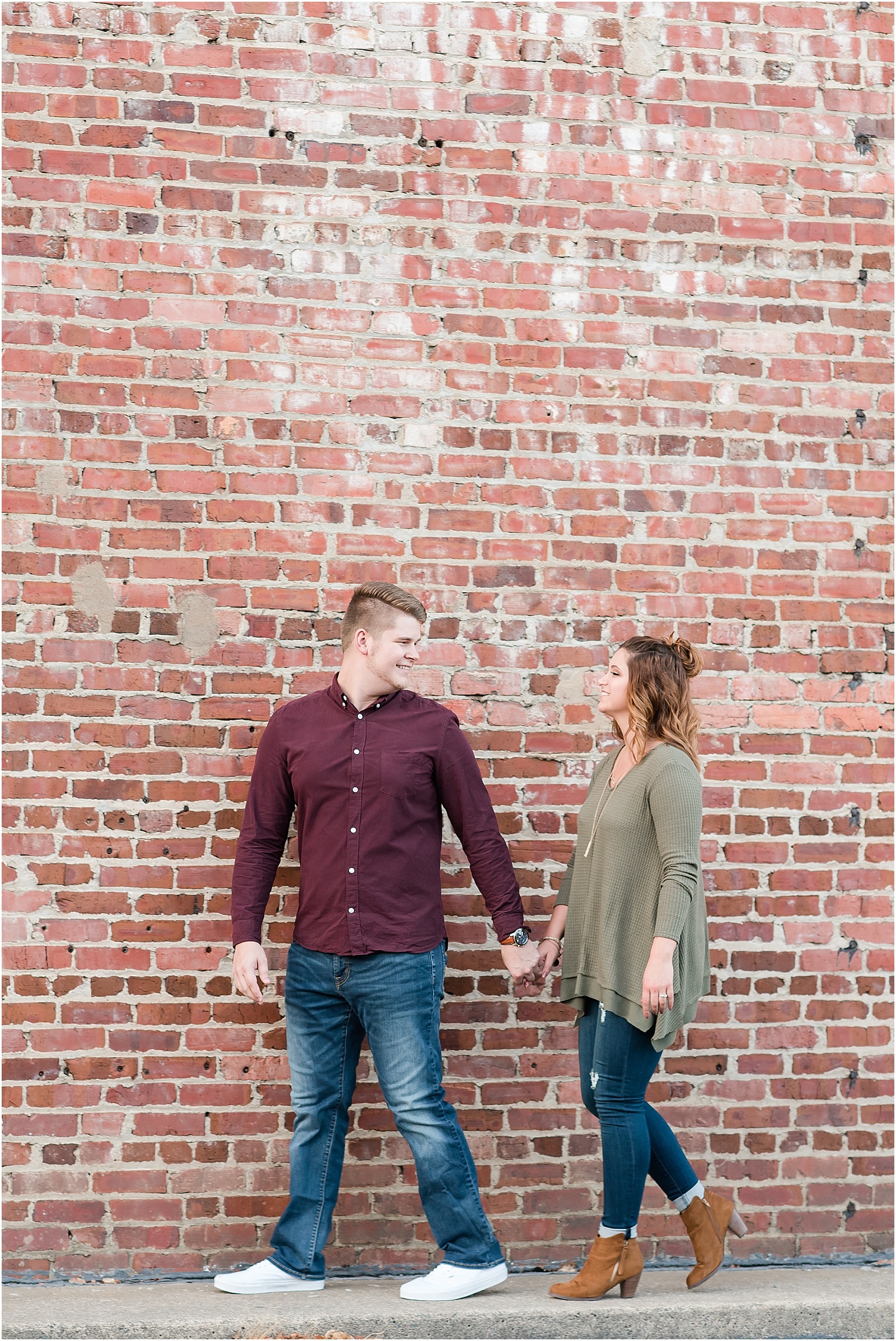 michelle and sara photography, downtown greensboro engagement session, downtown greensboro, couple shot, kissing shot, fall inspired clothing, fall inspired engagement session, fall inspired engagement, industrial engagement session, 