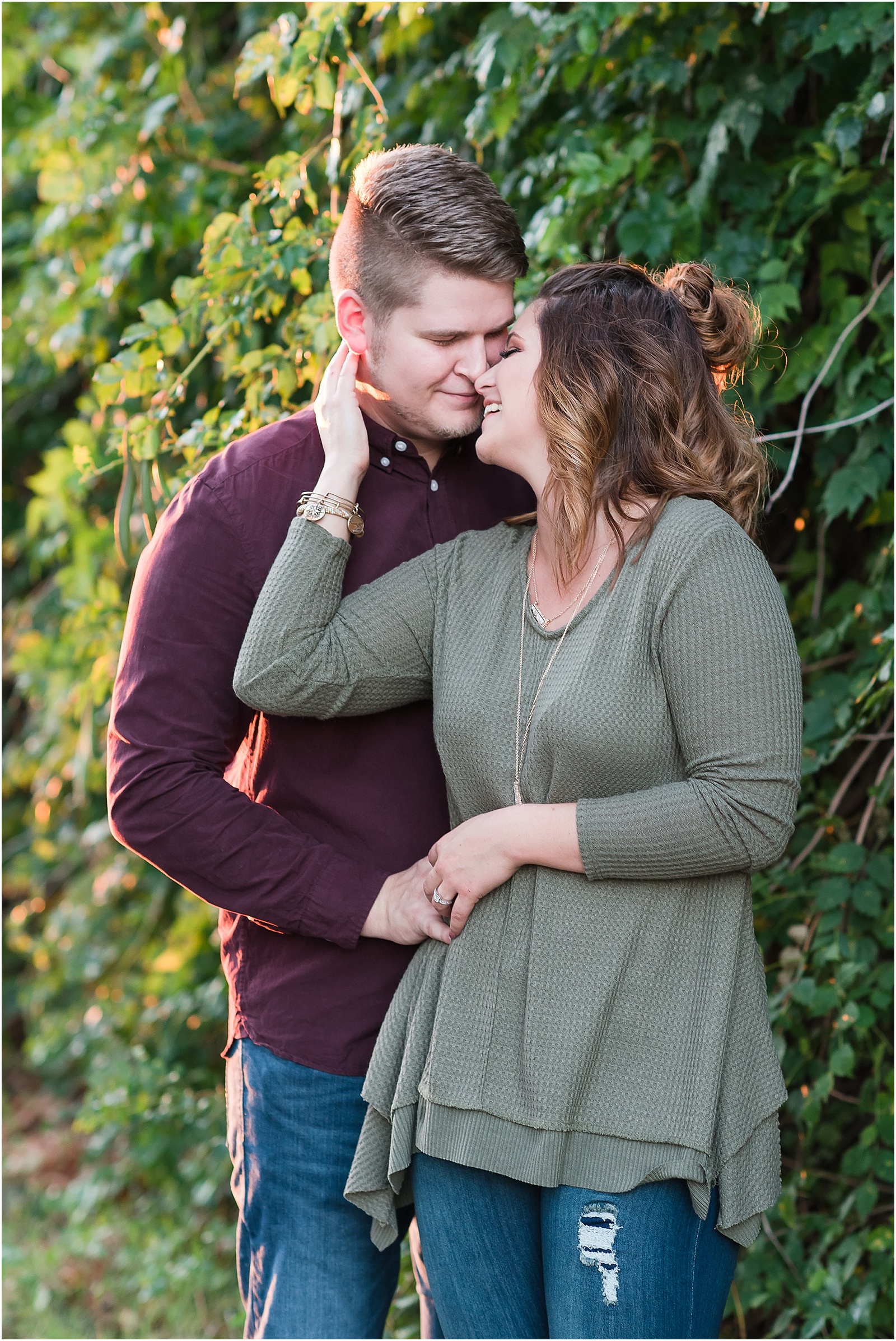 michelle and sara photography, downtown greensboro engagement session, downtown greensboro, couple shot, kissing shot, fall inspired clothing, fall inspired engagement session, fall inspired engagement, industrial engagement session, 