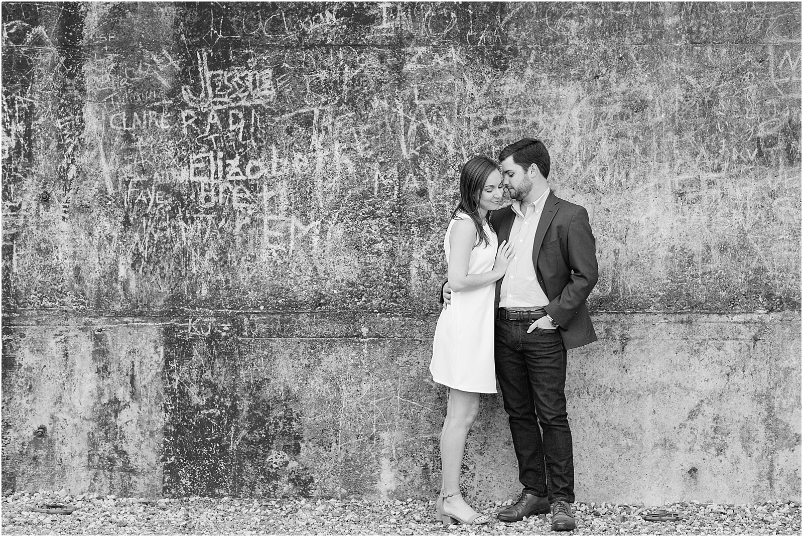 michelle and sara photography, saxapahaw, the rivermill lofts, chic engagement outfit, chic engagement session, saxapahaw engagement session, navy blue suit, brick arched backgroung, north carolina engagement, nc engagement, nc engagement photographer, 2018 bride, 2018 wedding, black and white, black and white photography
