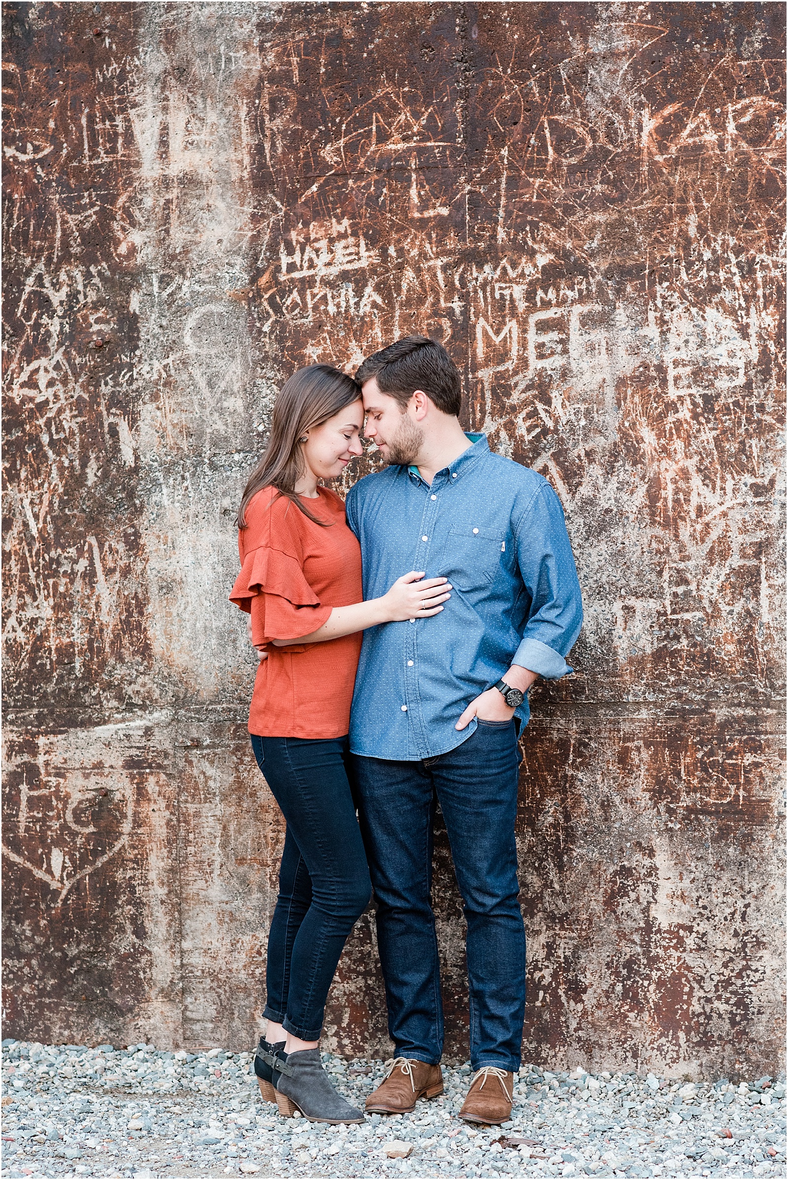 michelle and sara photography, saxapahaw, the rivermill lofts, chic engagement outfit, chic engagement session, saxapahaw engagement session, navy blue suit, brick arched backgroung, north carolina engagement, nc engagement, nc engagement photographer, 2018 bride, 2018 wedding