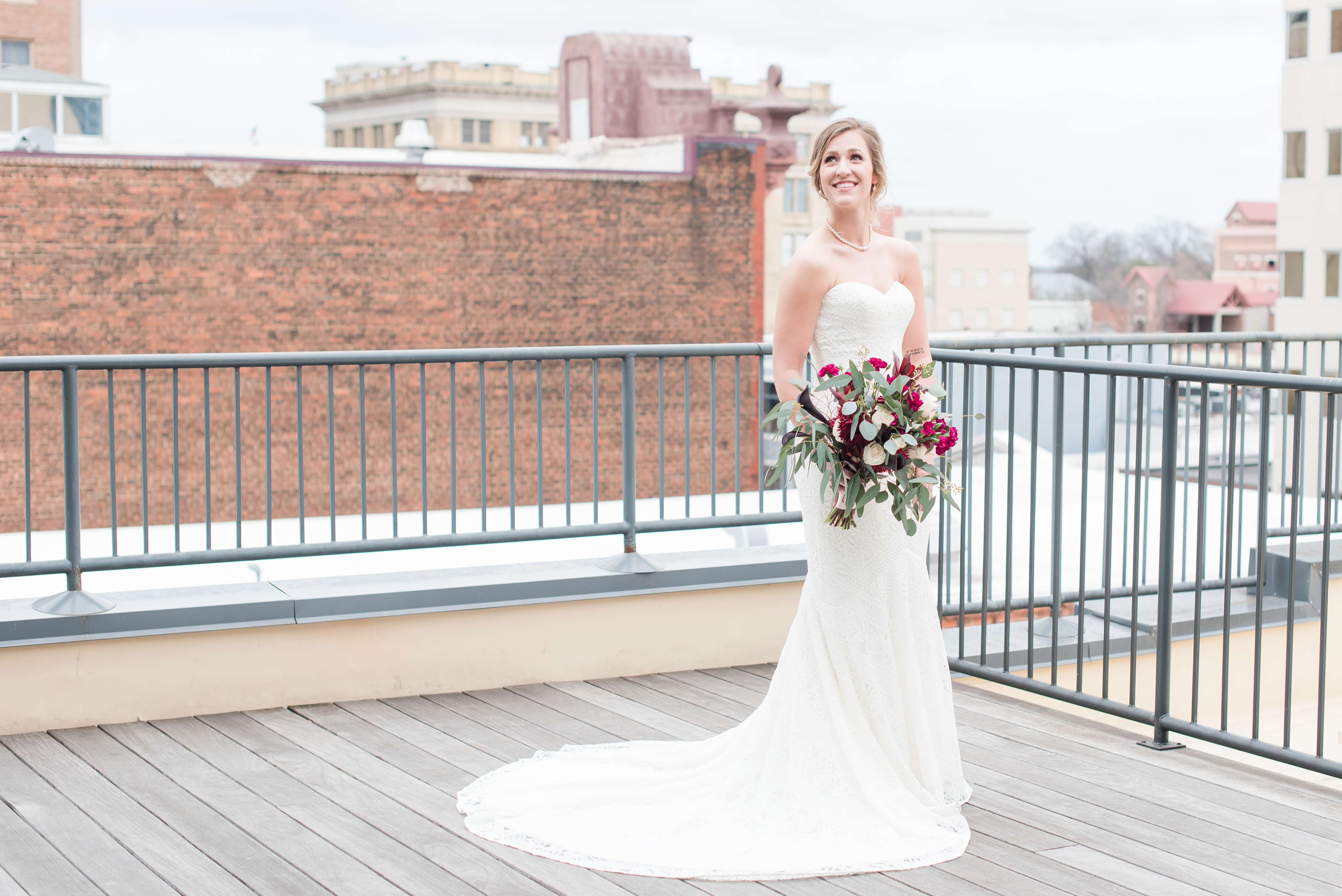bridal portrait outside overlooking downtown Raleigh at the Glass Box