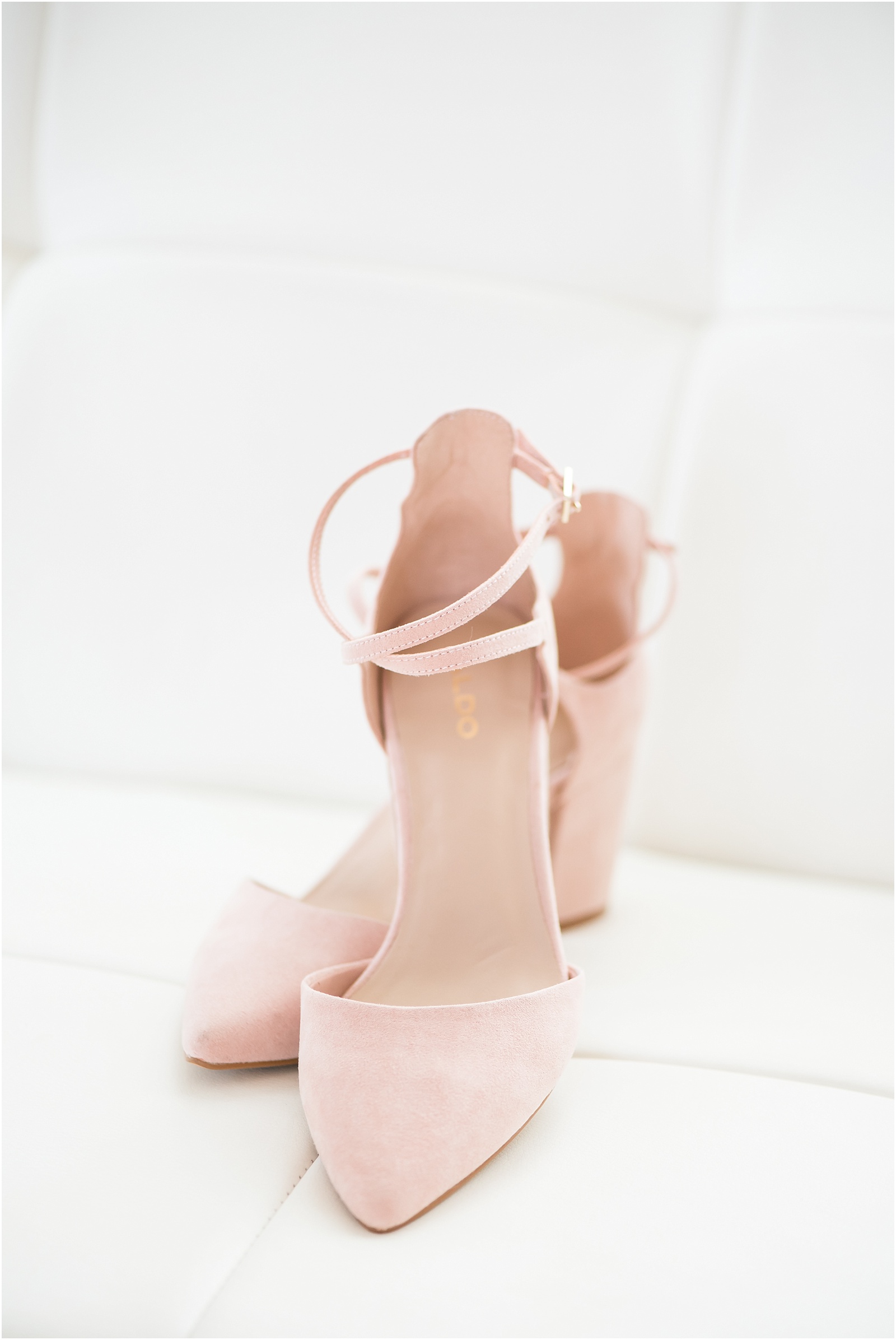 Pink suede shoes for bride at the glass box