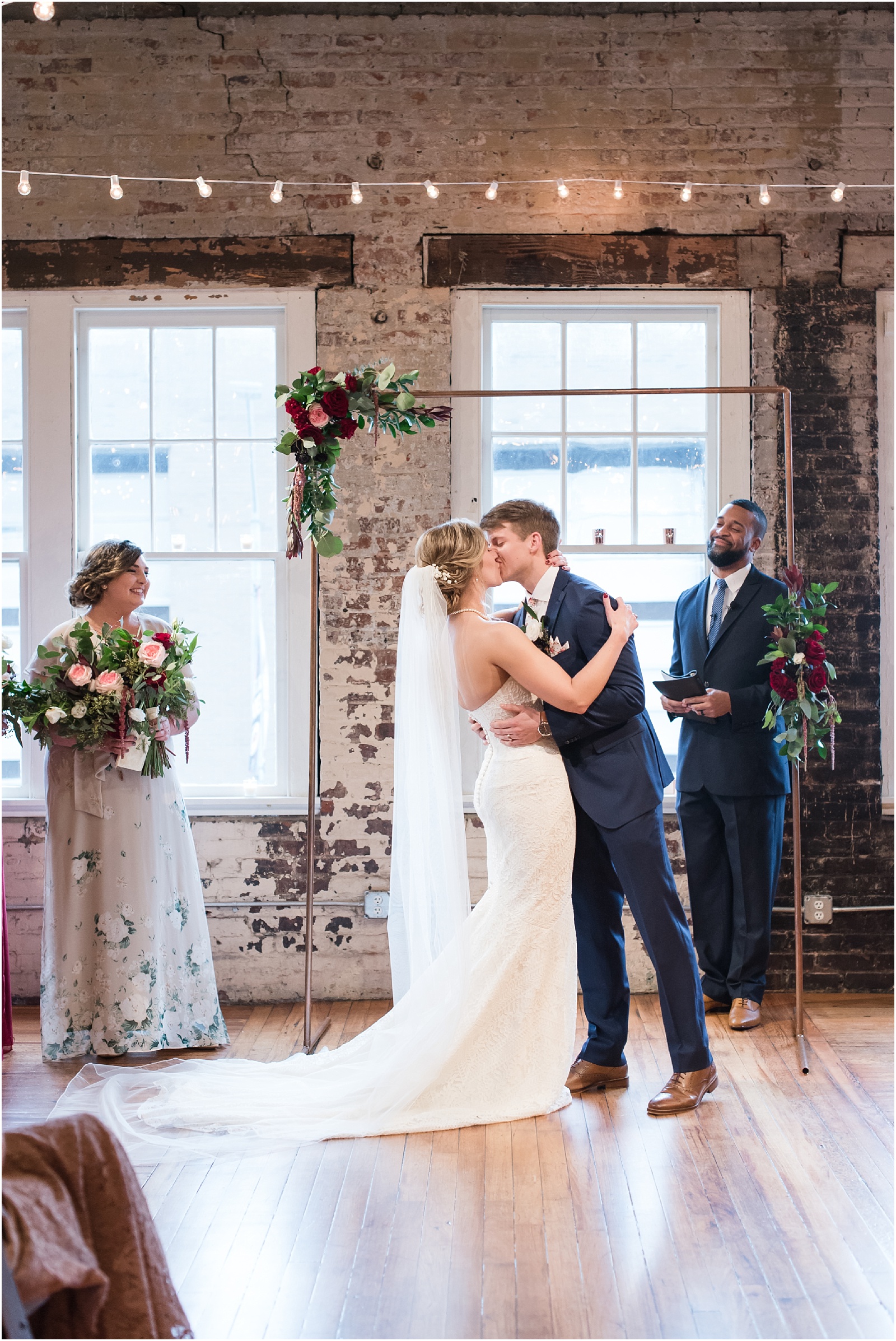 Bride and Groom kissing after being pronounced being married at the Stockroom at 230