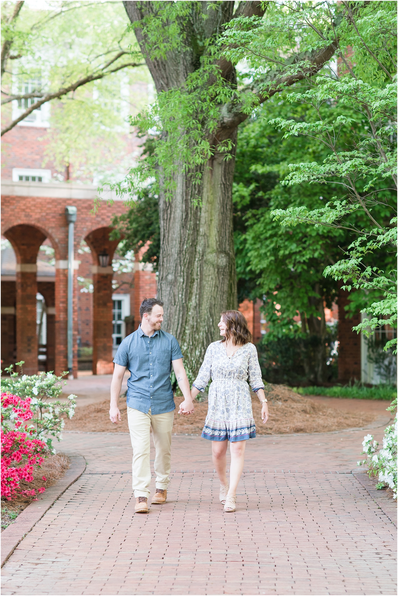young couple walking through garden at Elon College