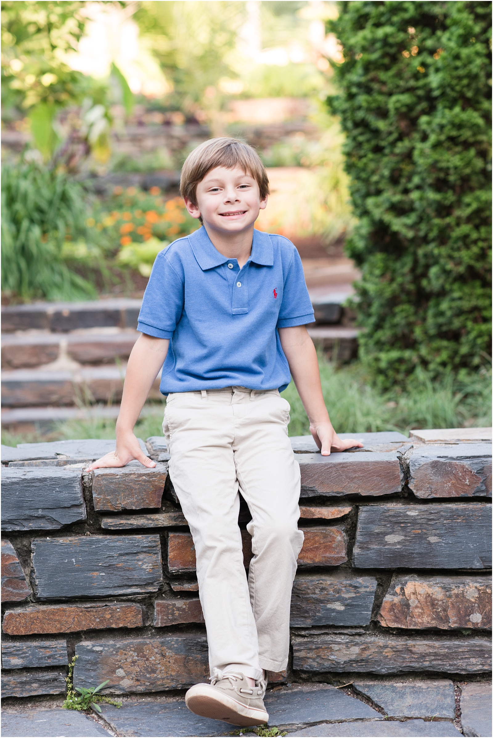 a photograph of the son sitting on a bench at Duke Gardens