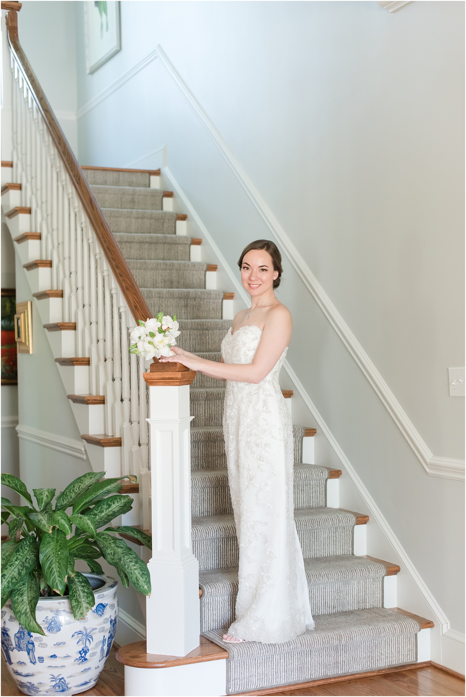 bride standing on stair case at a bridal session at a Home Estate