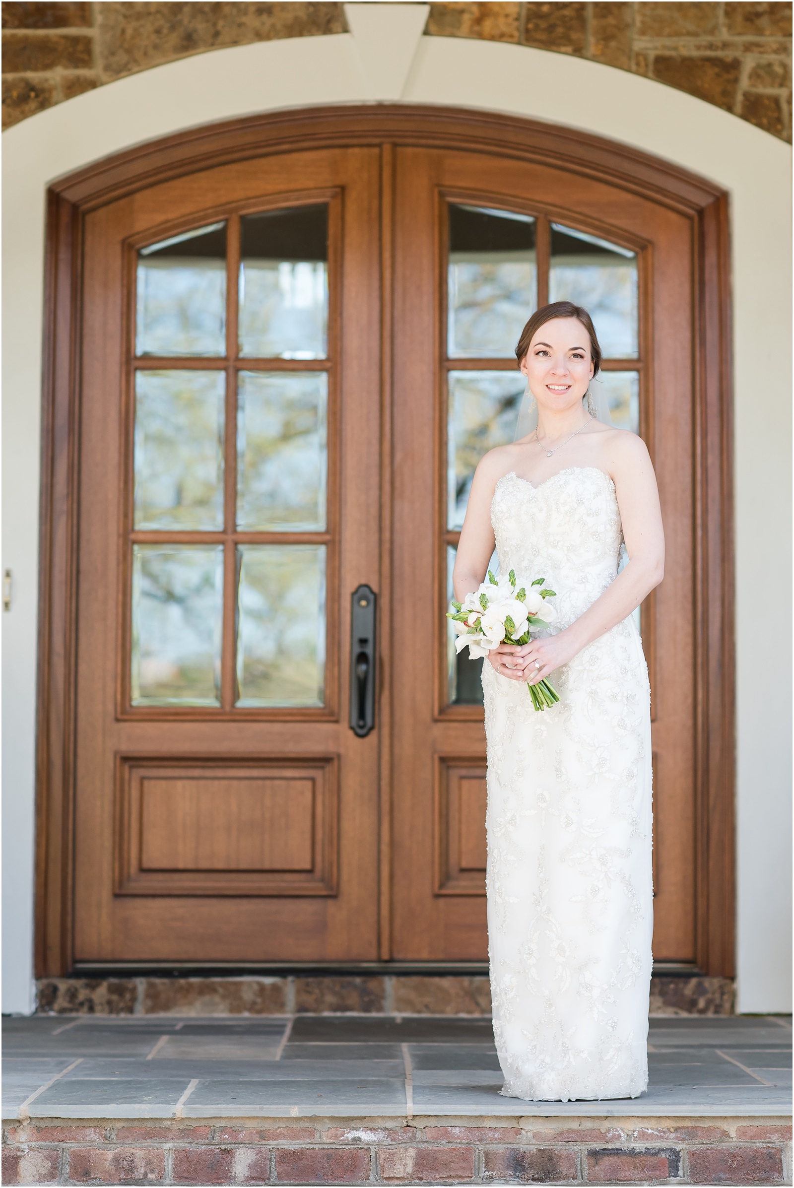a bride looking off standing on a front porch at a Home Estate bridal session