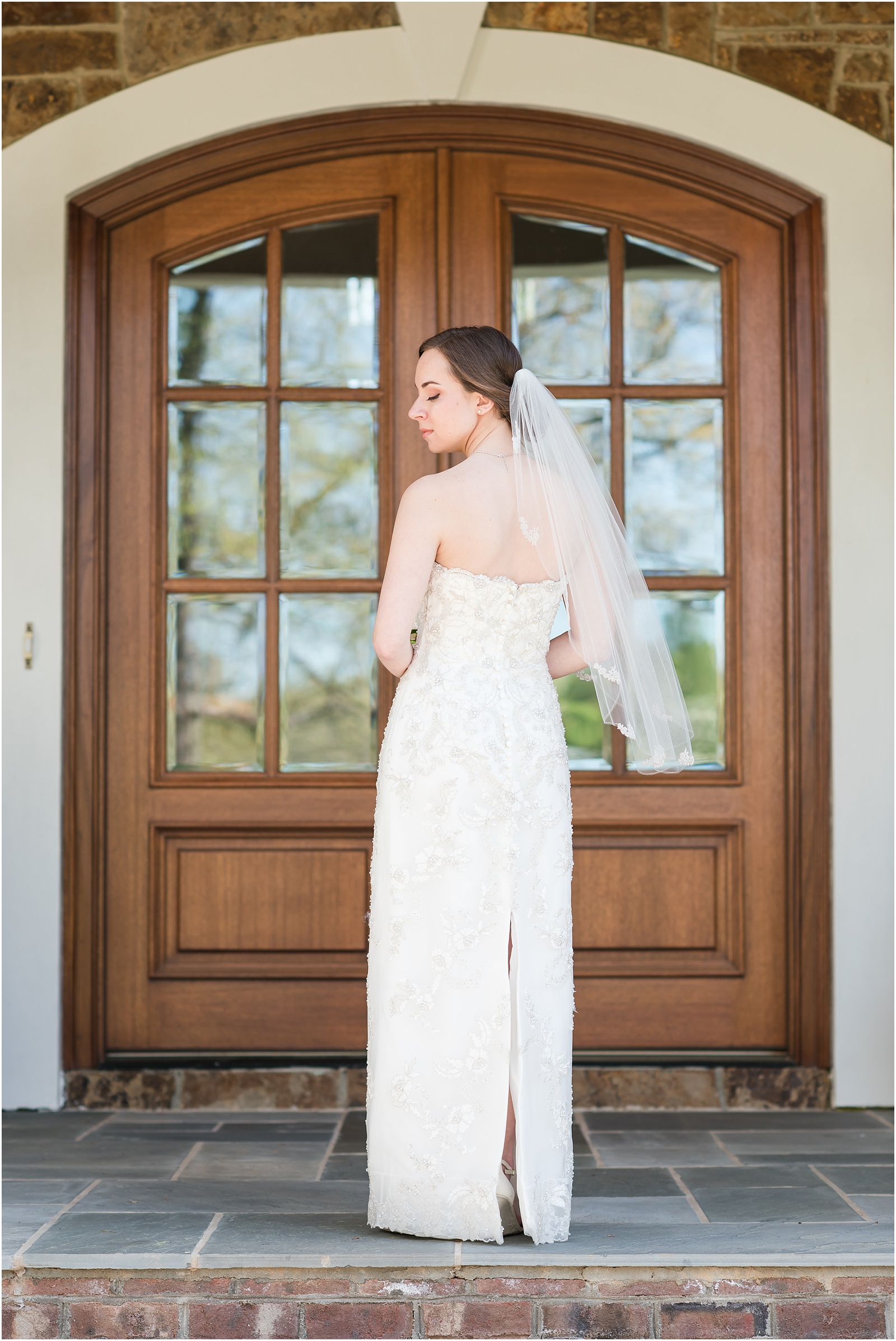 bride showing back of the wedding dress on front porch at a Home Estate