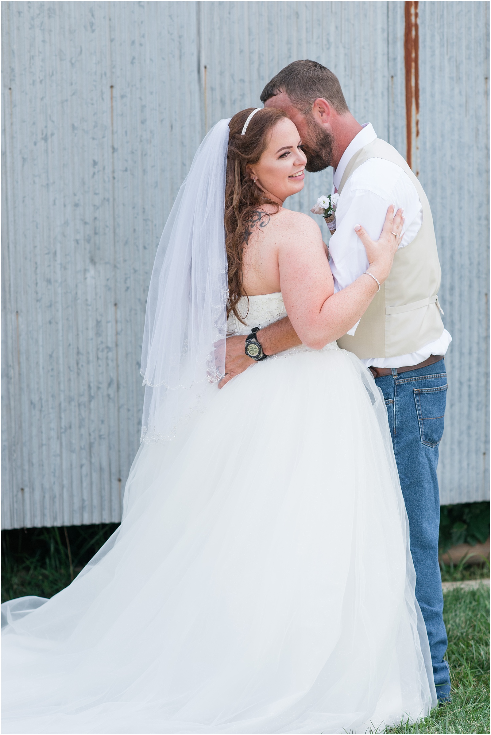 bride and groom nuzzled into each other at Starlight Meadow