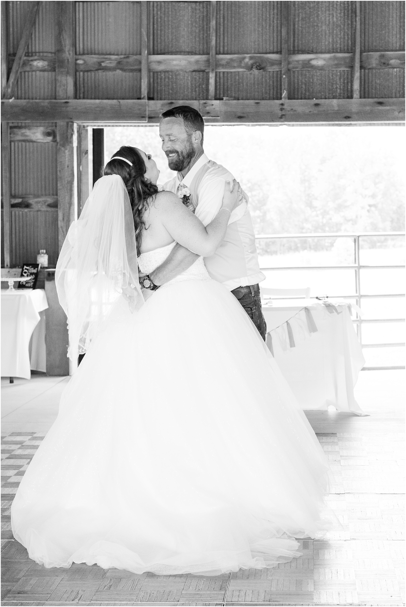 bride and groom first dance in black and white at Starlight Meadow