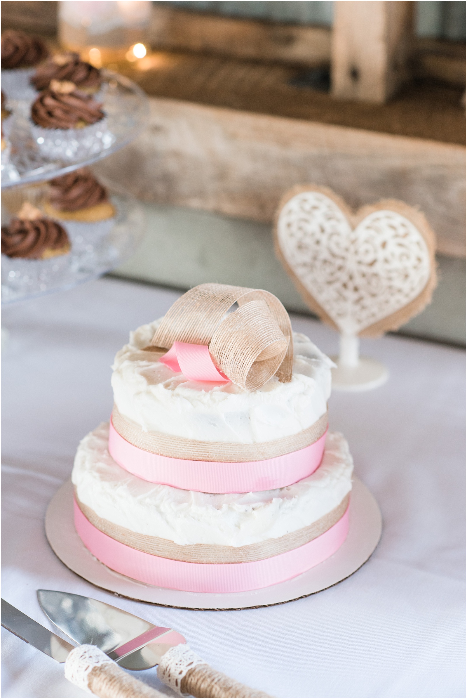 pink and tan wedding cake at Starlight Meadow