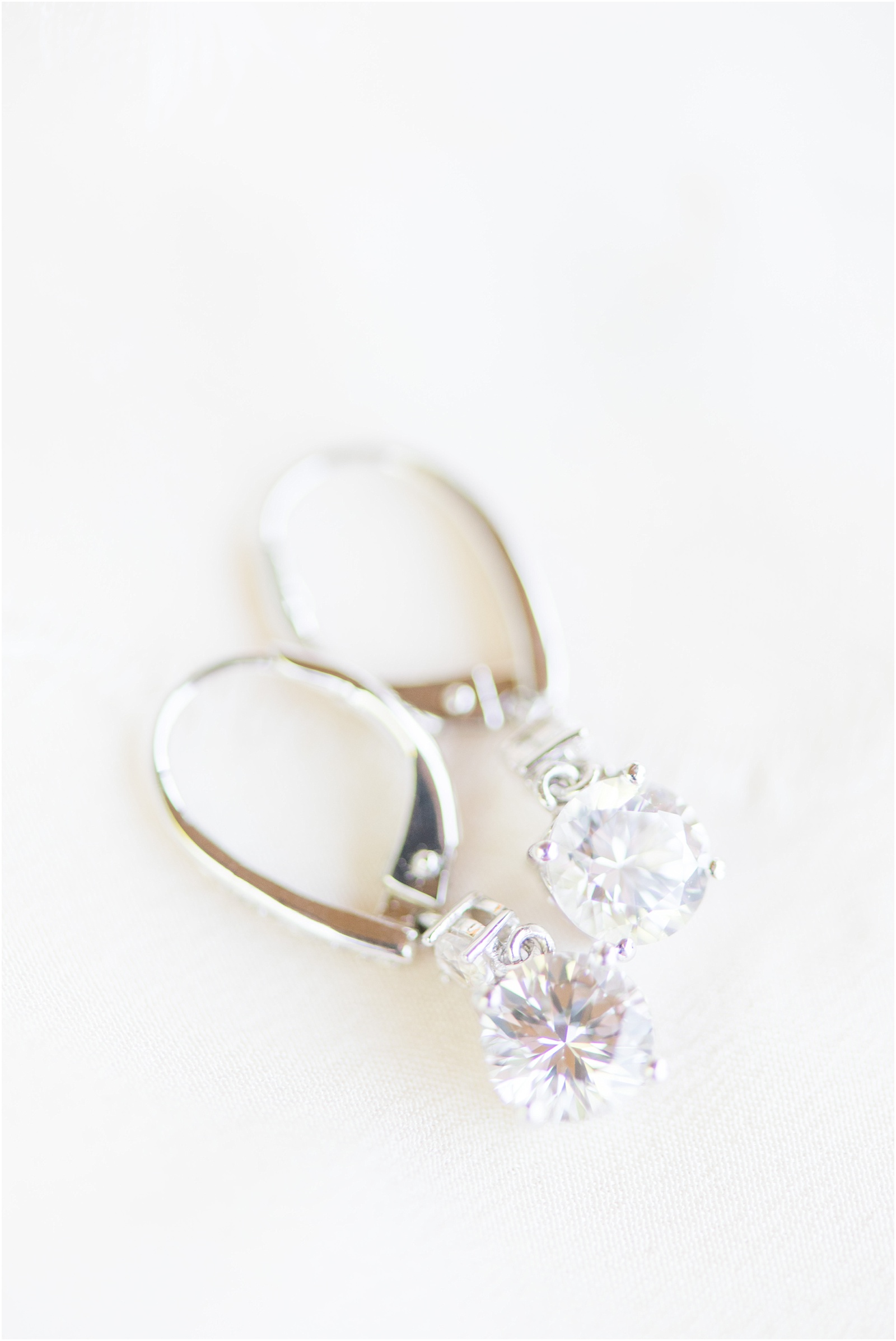 close up photograph of wedding earrings at Starlight Meadow
