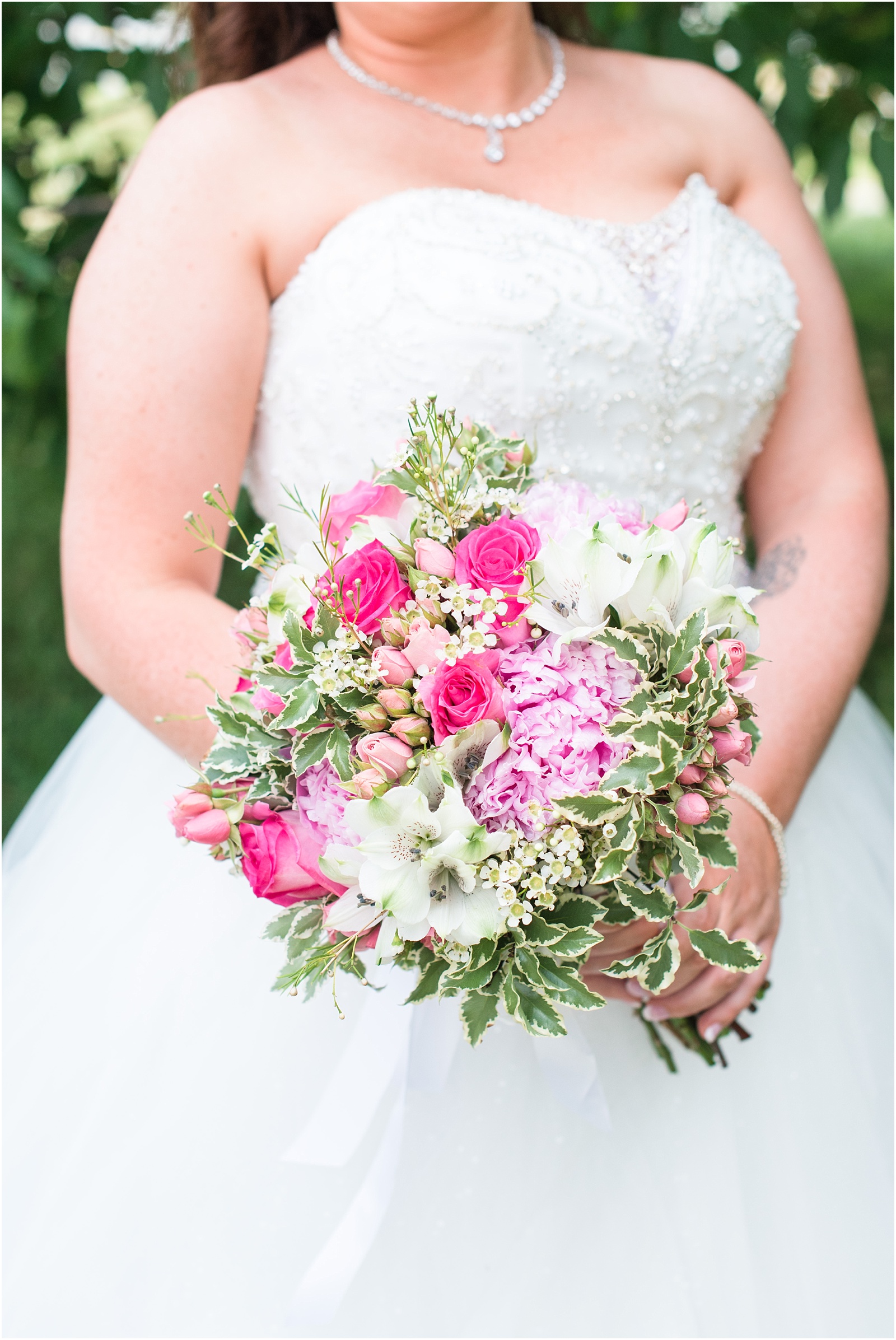 close up detail of pink, green, and white wedding bouquet at Starlight Meadow