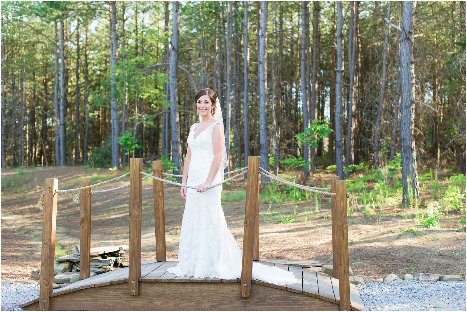 Bride standing on bridge for bridal session photograph at The Meadows At Walnut Cove